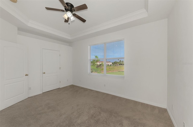 1156 Jonah Dr, North Port, FL 34289 - spare room with carpet flooring, a raised ceiling, and crown molding