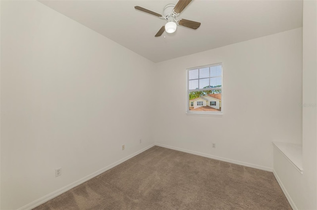 1156 Jonah Dr, North Port, FL 34289 - empty room featuring light colored carpet, baseboards, and a ceiling fan