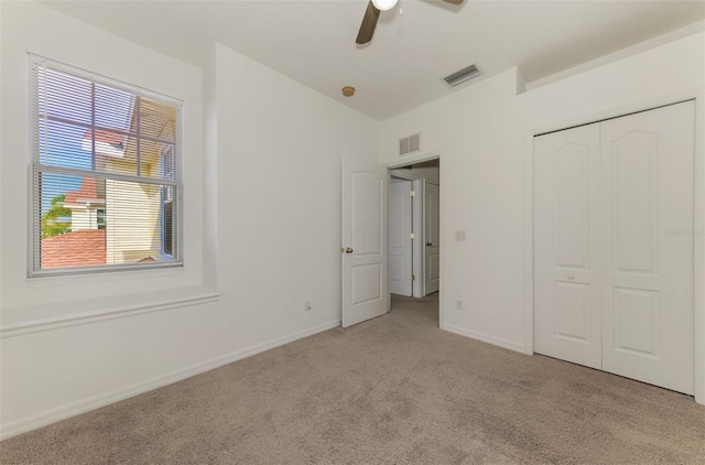 1156 Jonah Dr, North Port, FL 34289 - unfurnished bedroom featuring baseboards, visible vents, a closet, and carpet