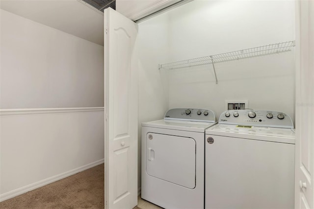 1156 Jonah Dr, North Port, FL 34289 - laundry room with washer and clothes dryer, light carpet, laundry area, baseboards, and visible vents