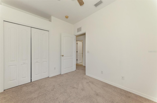 1156 Jonah Dr, North Port, FL 34289 - unfurnished bedroom with carpet flooring, a closet, baseboards, and visible vents