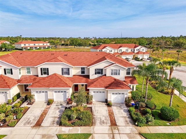 1156 Jonah Dr, North Port, FL 34289 - view of front facade featuring a residential view, a garage, and concrete driveway