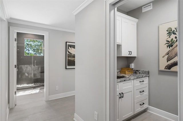 310 Severin Rd SE, Port Charlotte, FL 33952 - interior space with baseboards, crown molding, and visible vents