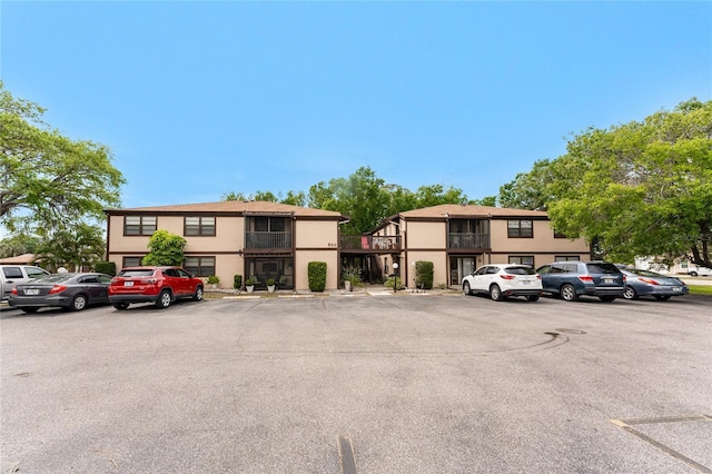 4022 Beaver Ln Unit 500C, Port Charlotte, FL 33952 - view of building exterior with uncovered parking