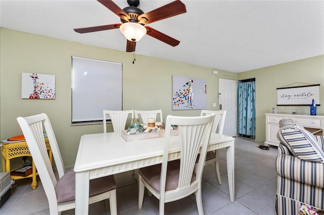 4022 Beaver Ln Unit 500C, Port Charlotte, FL 33952 - dining space featuring a textured ceiling, ceiling fan, and light tile patterned floors