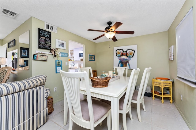 4022 Beaver Ln Unit 500C, Port Charlotte, FL 33952 - dining space featuring a ceiling fan, light tile patterned floors, and baseboards