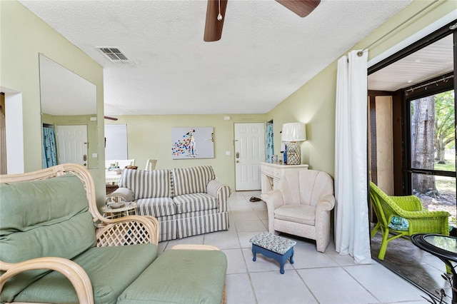 4022 Beaver Ln Unit 500C, Port Charlotte, FL 33952 - living area featuring a ceiling fan, tile patterned flooring, and a textured ceiling