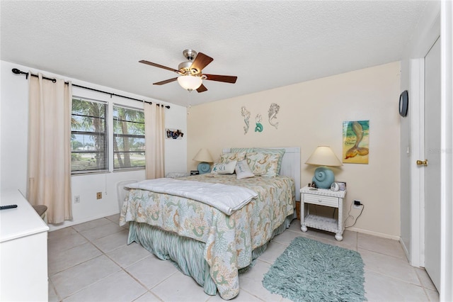 4022 Beaver Ln Unit 500C, Port Charlotte, FL 33952 - bedroom featuring light tile patterned flooring, ceiling fan, and a textured ceiling