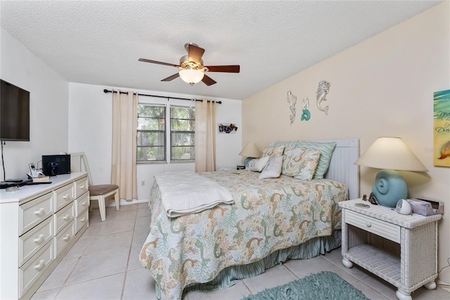 4022 Beaver Ln Unit 500C, Port Charlotte, FL 33952 - bedroom featuring light tile patterned floors, a ceiling fan, a textured ceiling, and a desk