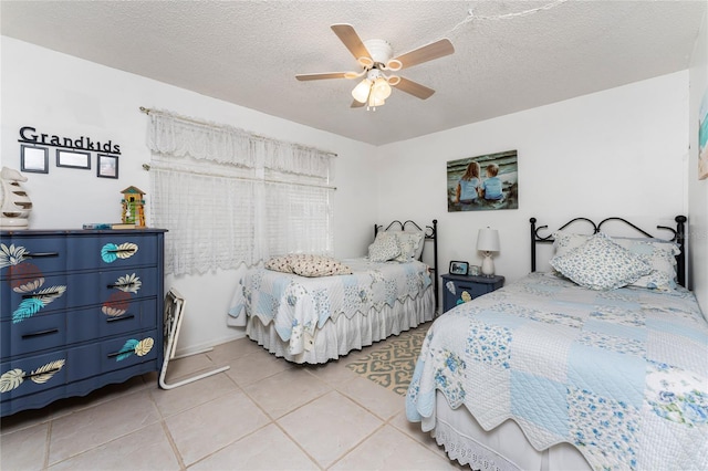 4022 Beaver Ln Unit 500C, Port Charlotte, FL 33952 - bedroom featuring light tile patterned floors, a textured ceiling, and ceiling fan