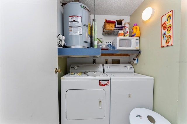 4022 Beaver Ln Unit 500C, Port Charlotte, FL 33952 - laundry room with washer and dryer, electric water heater, and a textured ceiling