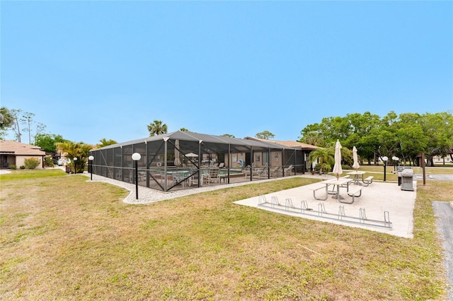 4022 Beaver Ln Unit 500C, Port Charlotte, FL 33952 - view of green lawn with a community pool, a lanai, and a patio area