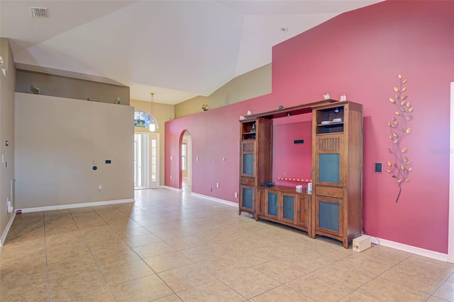 2699 Suncoast Lakes Blvd, Punta Gorda, FL 33980 - unfurnished room with tile patterned floors, arched walkways, high vaulted ceiling, and visible vents