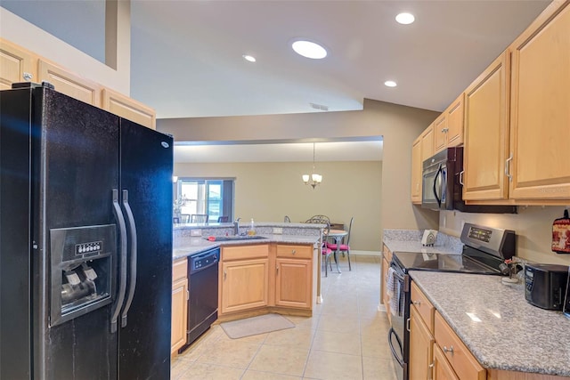 2699 Suncoast Lakes Blvd, Punta Gorda, FL 33980 - kitchen featuring a peninsula, light brown cabinetry, a sink, black appliances, and light tile patterned floors
