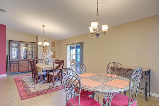 2699 Suncoast Lakes Blvd, Punta Gorda, FL 33980 - dining space with light tile patterned flooring, lofted ceiling, visible vents, and a chandelier