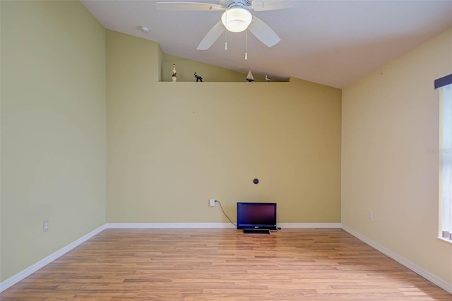 2699 Suncoast Lakes Blvd, Punta Gorda, FL 33980 - empty room with baseboards, vaulted ceiling, a ceiling fan, and light wood finished floors