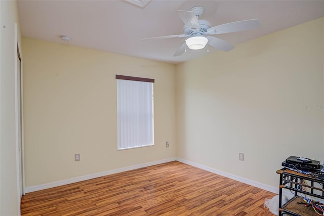 2699 Suncoast Lakes Blvd, Punta Gorda, FL 33980 - empty room with baseboards, wood finished floors, and a ceiling fan