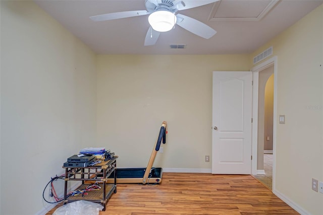2699 Suncoast Lakes Blvd, Punta Gorda, FL 33980 - workout room with arched walkways, baseboards, light wood-style flooring, and visible vents