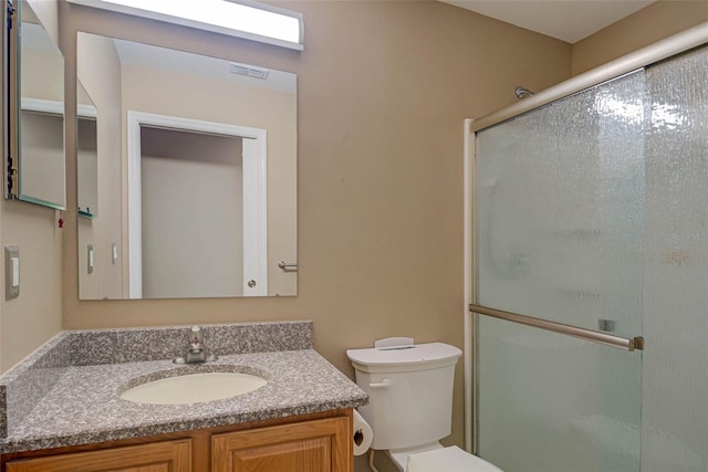 2699 Suncoast Lakes Blvd, Punta Gorda, FL 33980 - full bath with vanity, visible vents, toilet, and a shower stall