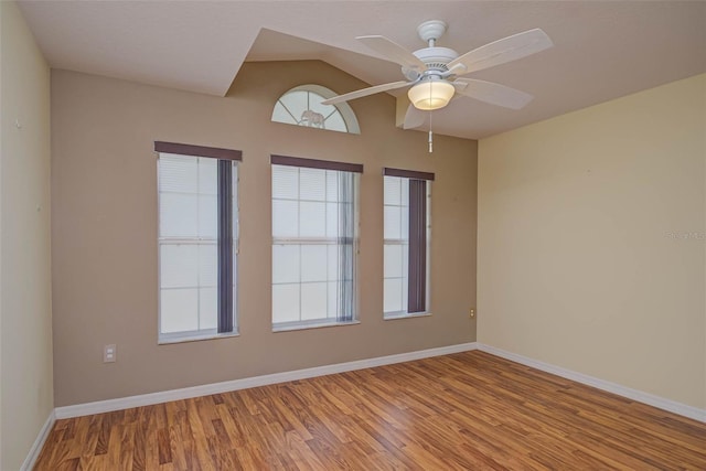 2699 Suncoast Lakes Blvd, Punta Gorda, FL 33980 - spare room with baseboards, lofted ceiling, wood finished floors, and ceiling fan