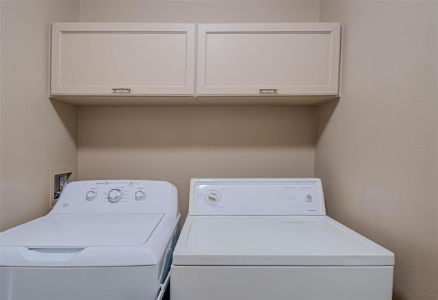 2699 Suncoast Lakes Blvd, Punta Gorda, FL 33980 - clothes washing area featuring cabinet space and washing machine and dryer