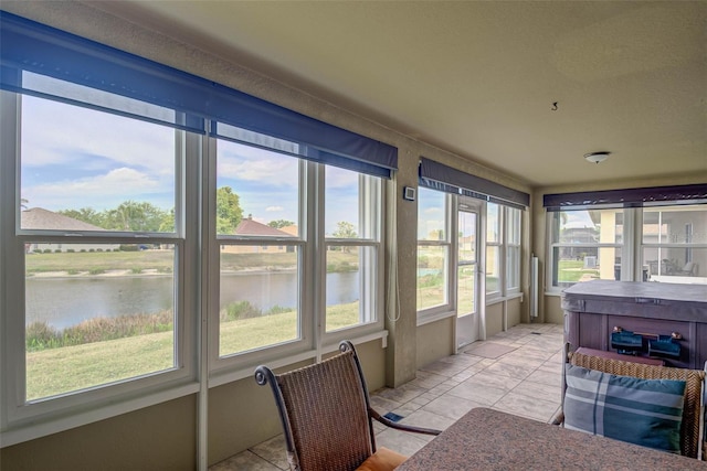 2699 Suncoast Lakes Blvd, Punta Gorda, FL 33980 - sunroom / solarium with a water view and a hot tub