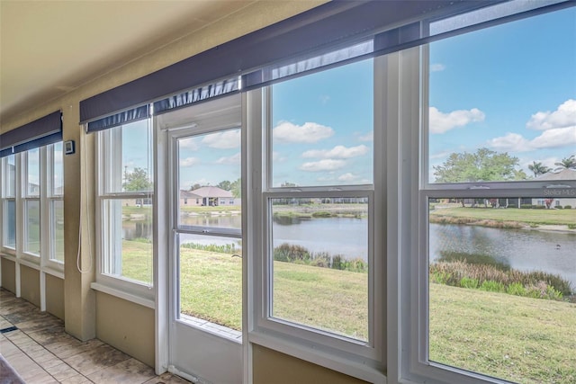 2699 Suncoast Lakes Blvd, Punta Gorda, FL 33980 - unfurnished sunroom featuring a water view