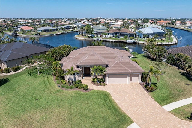 birds eye view of property with a residential view and a water view