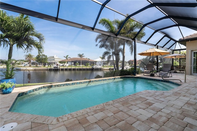 outdoor pool featuring a residential view, a lanai, a water view, and a patio area