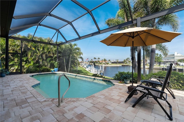 outdoor pool featuring a water view, a lanai, and a patio area
