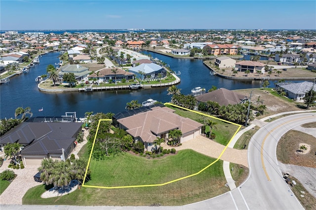 drone / aerial view with a residential view and a water view