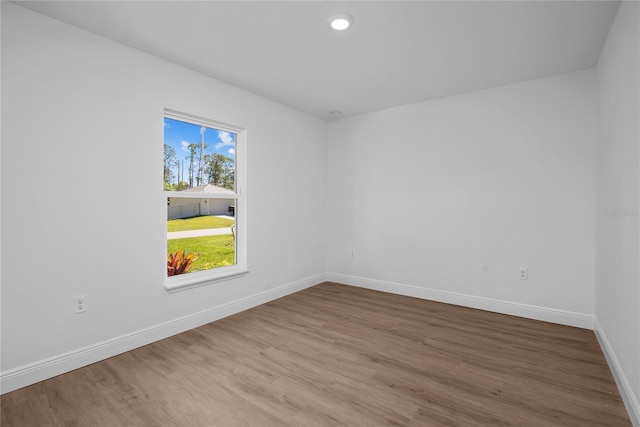 1589 Boswell St, North Port, FL 34288 - spare room featuring wood finished floors, baseboards, and recessed lighting