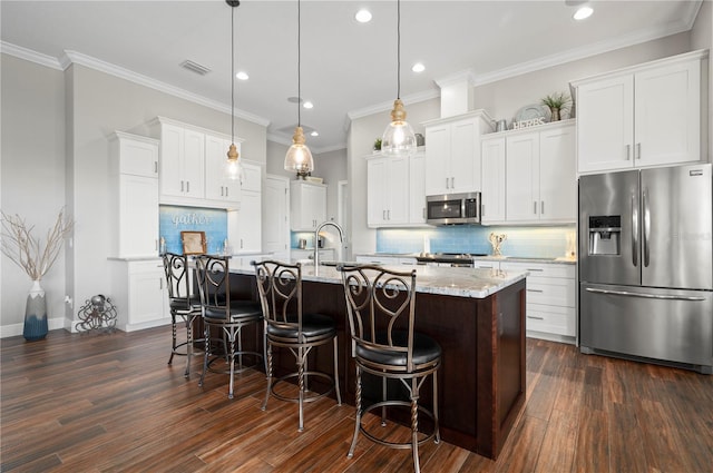 347 Portofino Dr, Punta Gorda, FL 33950 - kitchen featuring appliances with stainless steel finishes, recessed lighting, dark wood-style floors, decorative backsplash, and ornamental molding