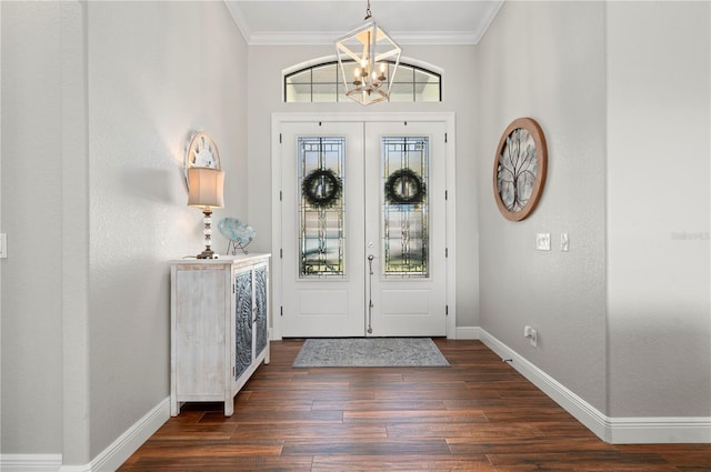 347 Portofino Dr, Punta Gorda, FL 33950 - entrance foyer featuring a chandelier, crown molding, and dark wood-style floors