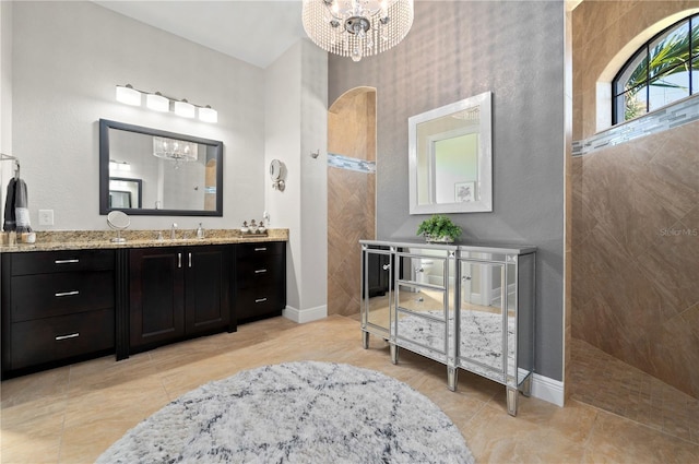 347 Portofino Dr, Punta Gorda, FL 33950 - bathroom with a chandelier, vanity, a walk in shower, and tile patterned flooring