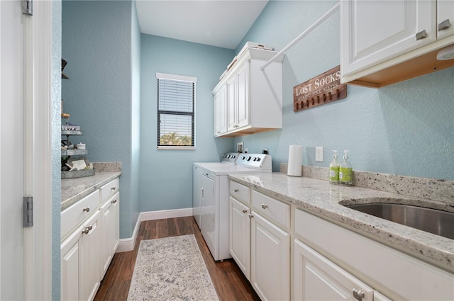 347 Portofino Dr, Punta Gorda, FL 33950 - washroom featuring cabinet space, washing machine and dryer, dark wood-style flooring, and a textured wall