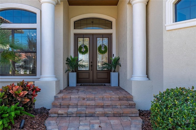 347 Portofino Dr, Punta Gorda, FL 33950 - doorway to property with french doors and stucco siding