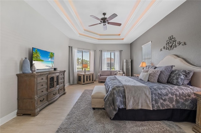 347 Portofino Dr, Punta Gorda, FL 33950 - bedroom with a tray ceiling, ornamental molding, light wood finished floors, and ceiling fan