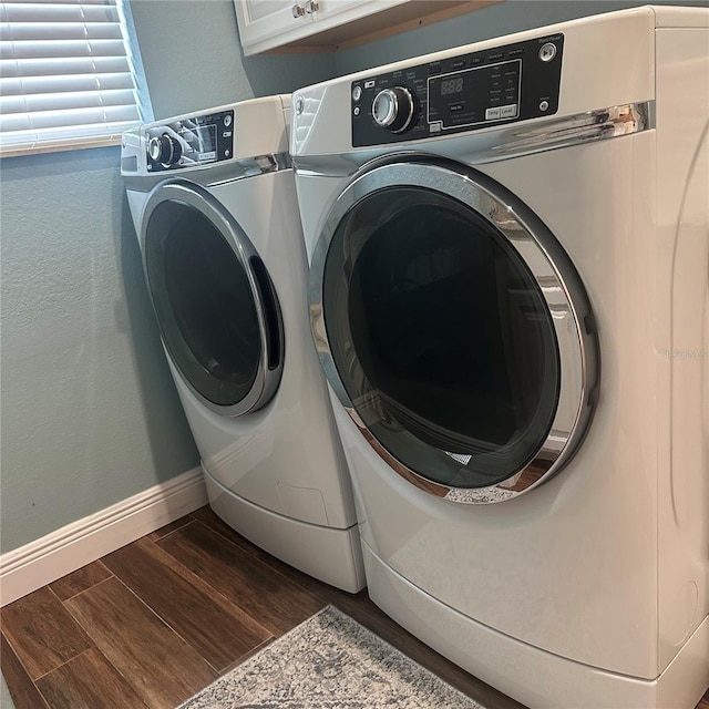 347 Portofino Dr, Punta Gorda, FL 33950 - laundry room with separate washer and dryer, wood finished floors, and cabinet space