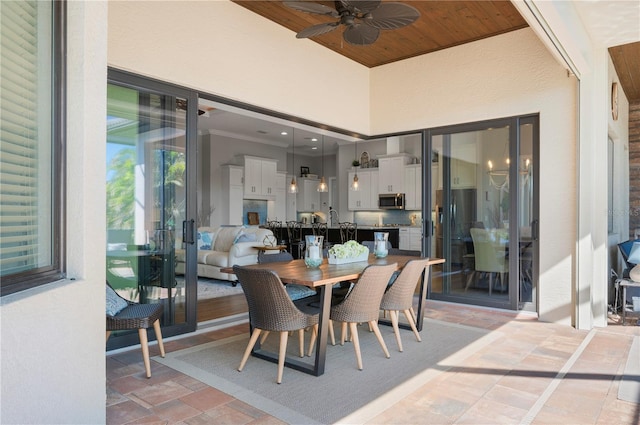 347 Portofino Dr, Punta Gorda, FL 33950 - dining space with ceiling fan, light stone finish flooring, and wood ceiling