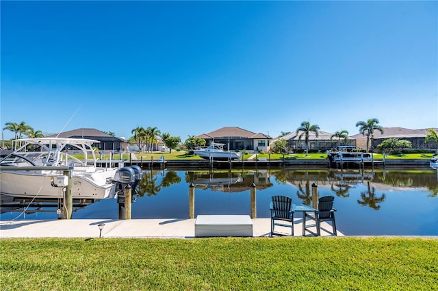 347 Portofino Dr, Punta Gorda, FL 33950 - dock area featuring a residential view, a water view, and a lawn