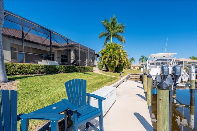347 Portofino Dr, Punta Gorda, FL 33950 - dock featuring boat lift, a yard, and a lanai