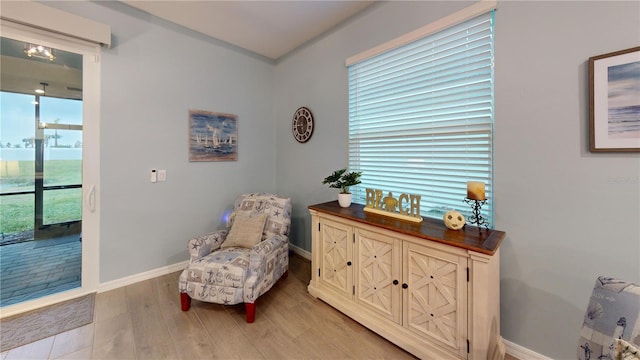 17420 Jadestone Ct, Venice, FL 34293 - sitting room with baseboards and light wood-type flooring