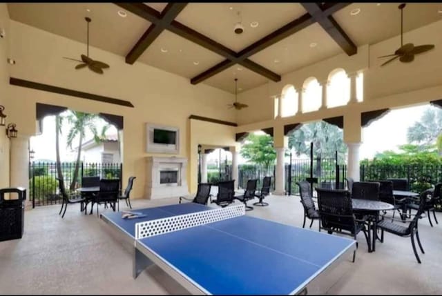 17420 Jadestone Ct, Venice, FL 34293 - view of patio / terrace with a ceiling fan, an outdoor fireplace, and outdoor dining space