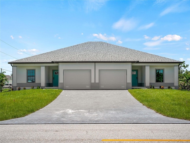 14449 Appleton Blvd, Port Charlotte, FL 33981 - view of front facade with a garage, a front lawn, and decorative driveway