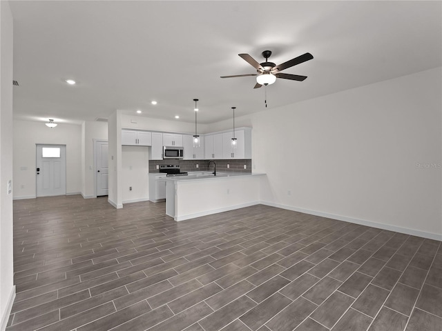 14449 Appleton Blvd, Port Charlotte, FL 33981 - unfurnished living room with recessed lighting, a ceiling fan, and dark wood finished floors