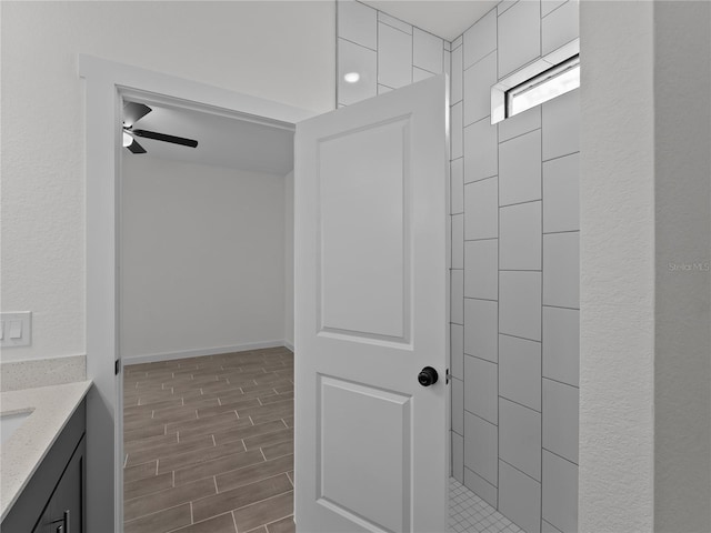 14449 Appleton Blvd, Port Charlotte, FL 33981 - bathroom with vanity, ceiling fan, wood finished floors, and tiled shower