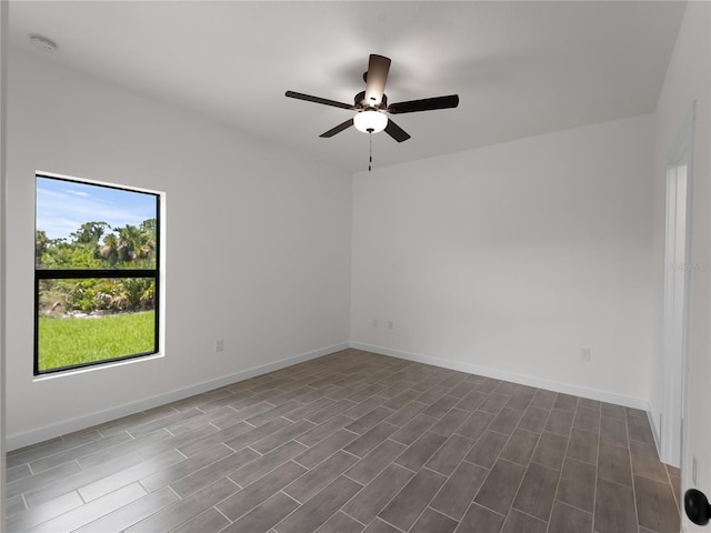 14449 Appleton Blvd, Port Charlotte, FL 33981 - unfurnished room with a ceiling fan, dark wood-style flooring, and a smoke detector