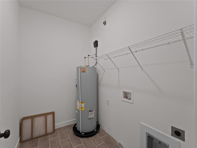 14449 Appleton Blvd, Port Charlotte, FL 33981 - laundry area with water heater, electric dryer hookup, hookup for a washing machine, and wood finish floors