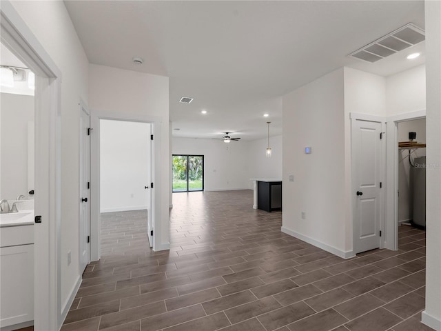 14449 Appleton Blvd, Port Charlotte, FL 33981 - hallway featuring recessed lighting and dark wood-style flooring